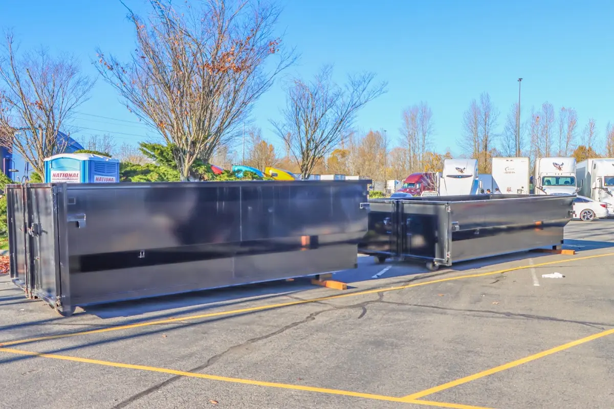 Professional dumpster rental service with roll-off container on residential driveway in Camarillo